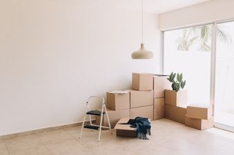 Boxes being moved into an empty apartment